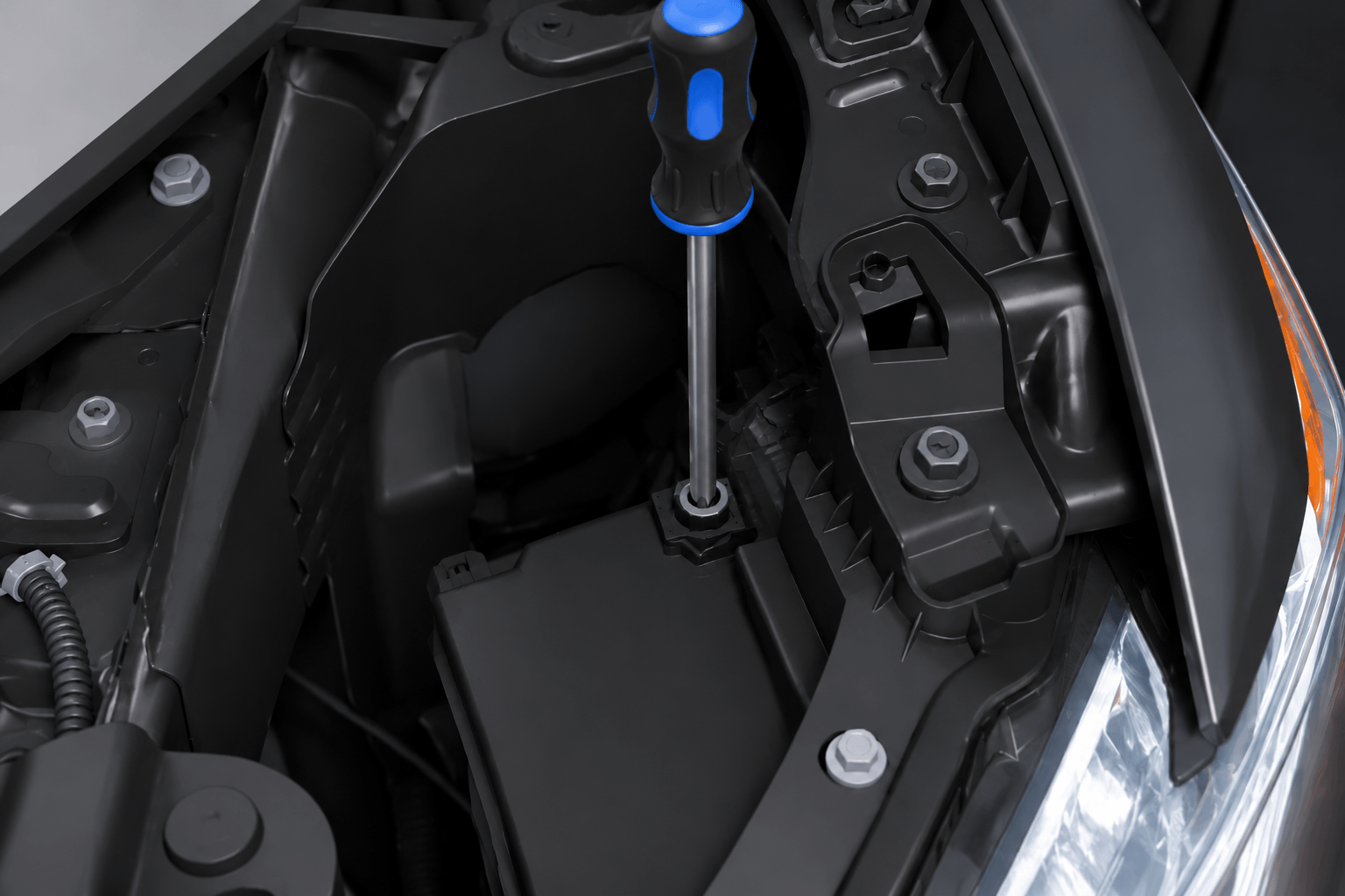 open the hood to adjust the headlights