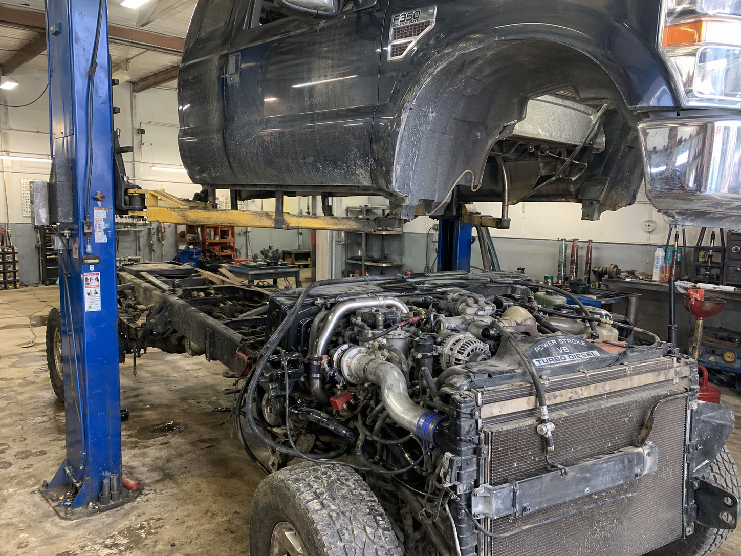 2009 Ford F-350 cab-off service view showing the crowded 6.4L Powerstroke engine layout