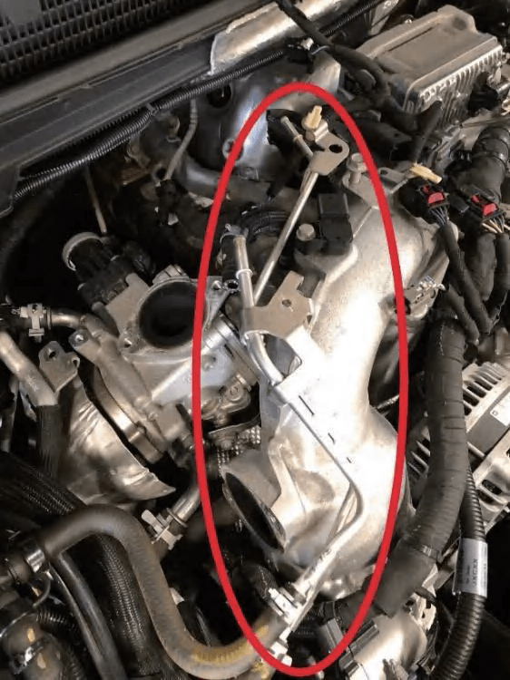 Aluminum coolant hardline on top of the Y-bridge