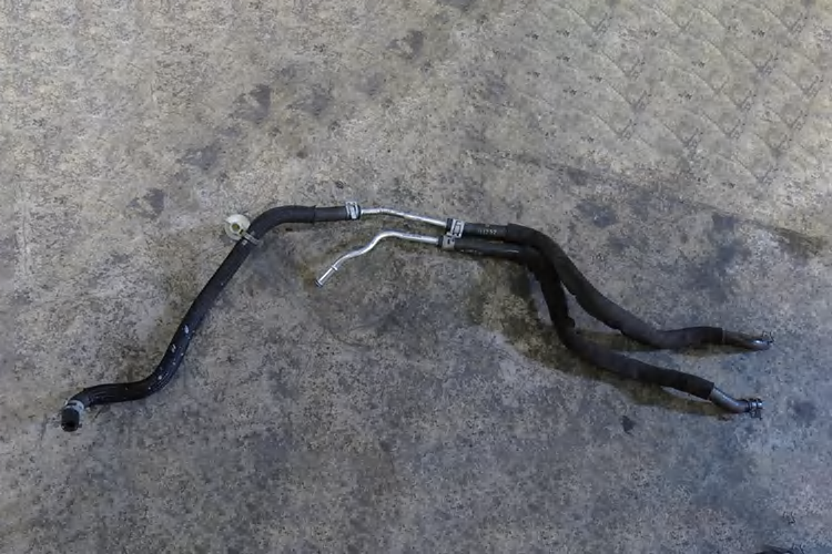 Removed urea injector coolant hose assembly
