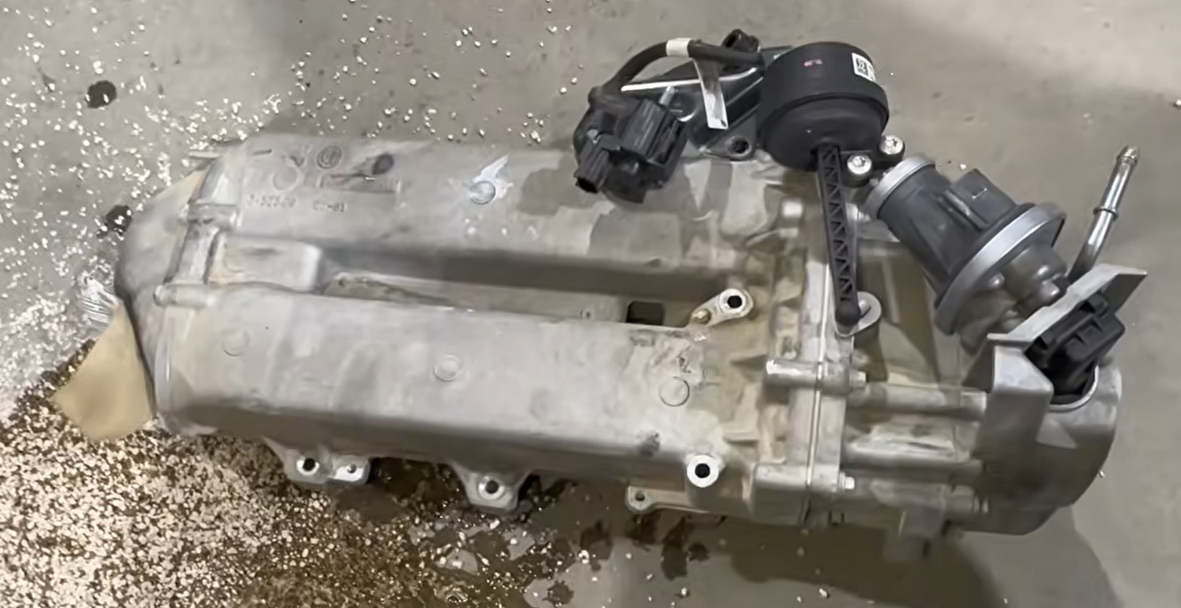 Factory EGR cooler removed from a 2020-2022 Ford 6.7 Power Stroke during a delete kit installation