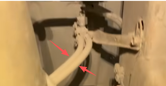 Frame-mounted emissions wiring components must be disconnected before removal.