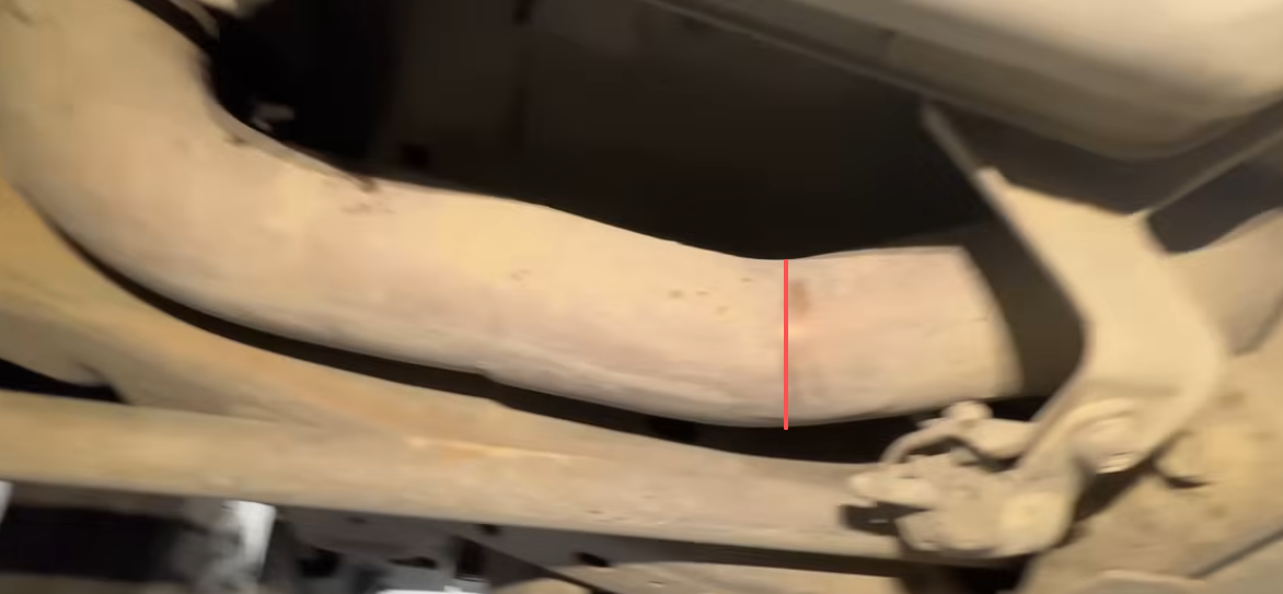 Cut the factory exhaust only after confirming the correct replacement pipe position.